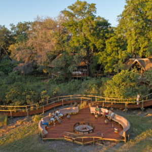 Aerial view of the decks and tents of Camp Moremi among riverine trees at Xakanaxa Lagoon, Moremi Game Reserve, Botswana
