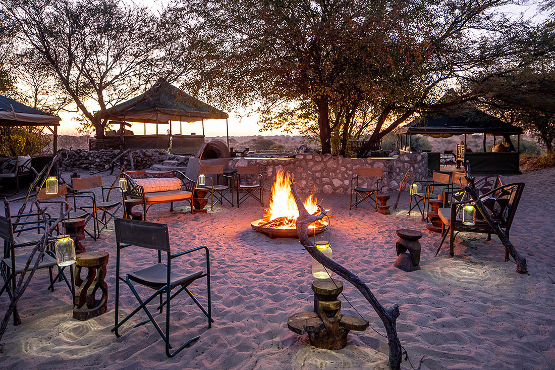 The lantern-lit fire circle in the sand at Meno a Kwena above the Boteti River, Botswana