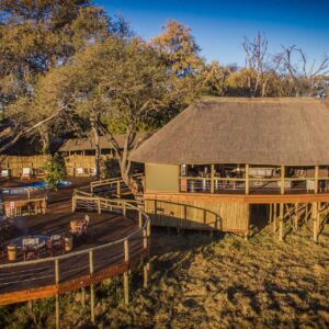 The thatched main area and deck of Mma Dinare raised above the Gomoti floodplain, Okavango Delta, Botswana