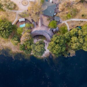 Aerial view of the tents and main area of Pom Pom Camp on the edge of Pom Pom Lagoon, Okavango Delta, Botswana