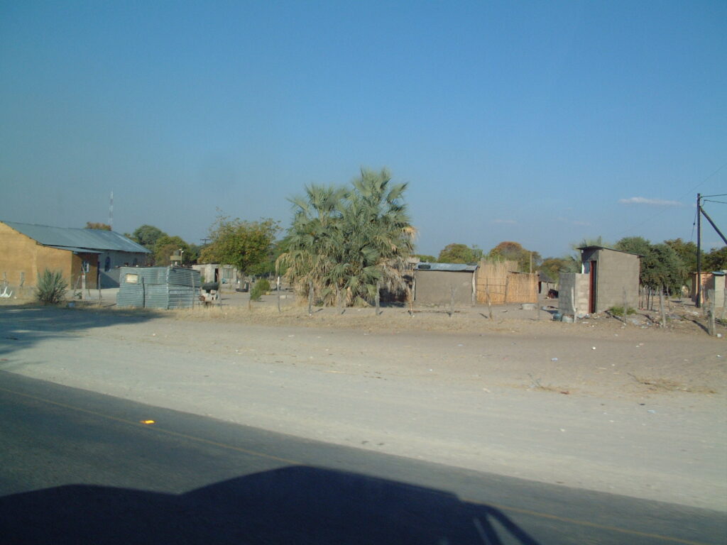 A road and roadside buildings in Maun, Botswana