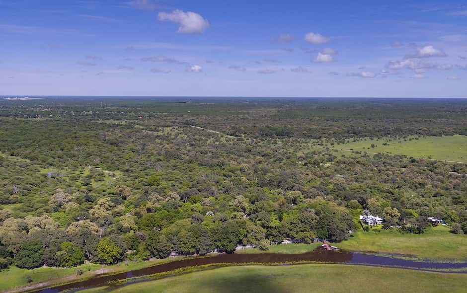 Wide aerial of the bush setting around Island Safari Lodge, Maun