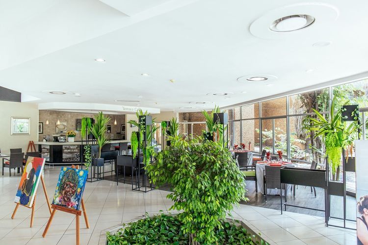 The planted atrium lounge and bar at Cresta Lodge Gaborone, Botswana